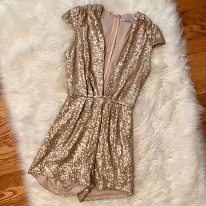 Sparkle the night away in this gold sequin romper!